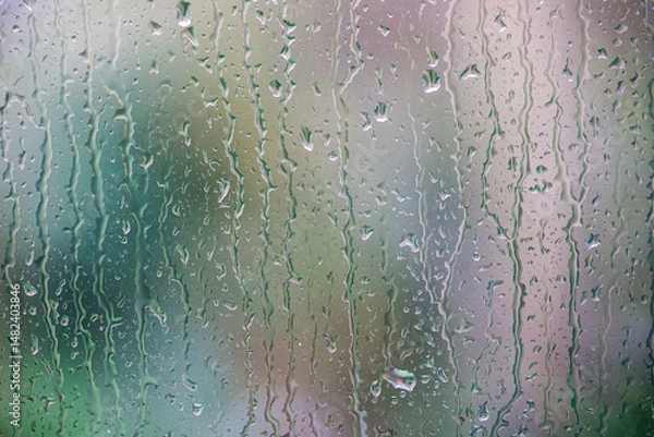 Fototapeta Rain on a window pane in closeup