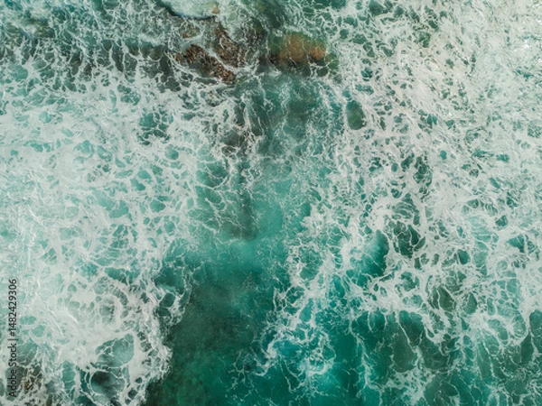 Obraz Aerial View of the Sea and Waves. The vast ocean stretches endlessly, with waves. Nature, tranquility, and adventure.	