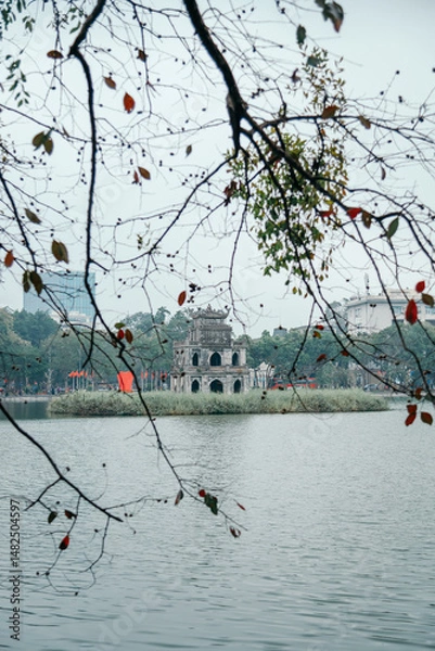Fototapeta Turtle Tower on Hoan Kiem Lake in cloudy weather, landmark of Hanoi, Vietnam