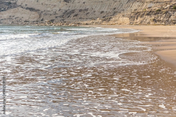 Fototapeta waves on the sandy beach of Cyprus..