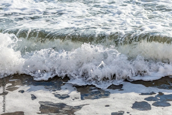Fototapeta waves on the sandy beach of Cyprus..