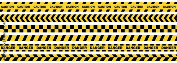 Fototapeta Caution warning barrier tape sign for web site road warning,  Black and yellow line. Seamless barrier. Included brushes,