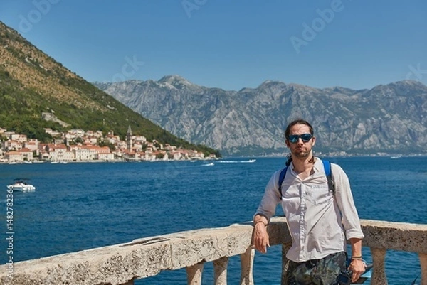Fototapeta Man standing on an island in Kotor Bay, Summer vacation
