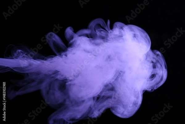 Fototapeta Beautiful smoke in purple light on dark background