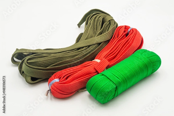 Obraz Colored ropes in vibrant shades of green, red, and olive isolated on white background