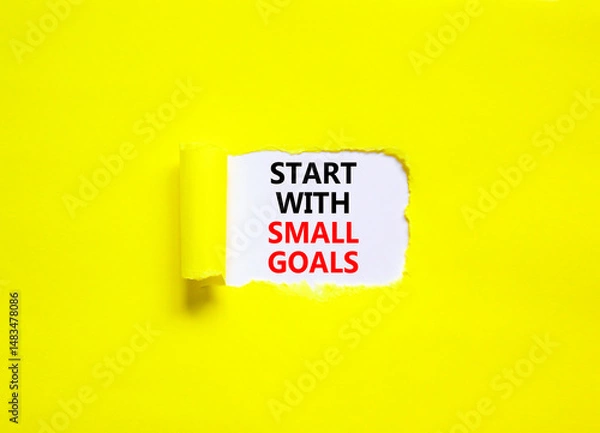 Fototapeta Start with small goals symbol. Concept words phrase Start with small goals on beautiful white paper. Beautiful yellow paper background. Business motivational Start with small goals concept. Copy space