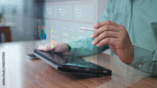 Obraz Professional using laptop with holographic dashboard and graphs – Data visualization and performance tracking concept in digital workplace.