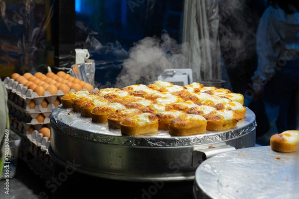 Obraz Freshly Cooked Korean Egg Bread Steaming on a Griddle, Seoul, South Korea, Myeongdong Market, Night Street Food Scene