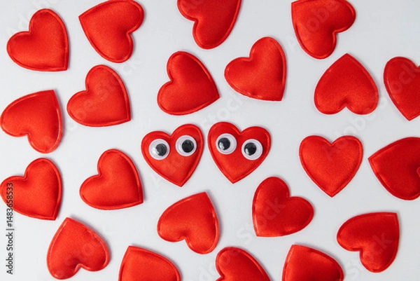 Obraz Set of red love hearts as decoration on white background.Hearts with googly eyes close to each other as symbol of warm relation