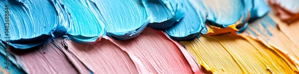 Fototapeta Thick, textured paint strokes in blue, pink, and yellow cover a surface. Concept of color and creativity. For art inspiration.
