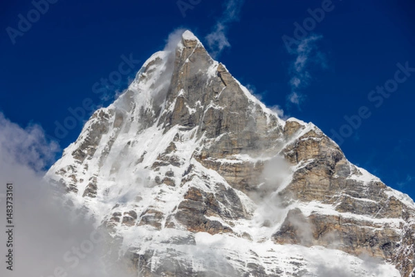Fototapeta Mera Peak high altitude mountain summit ascent in Himalayas. Stunning views above the clouds at sunrise from the top of the mountain. Alpine route climbing on the snow path in Himalayas