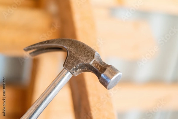 Obraz Construction hammer, Close-up on a metal hammer with wood structure in background.