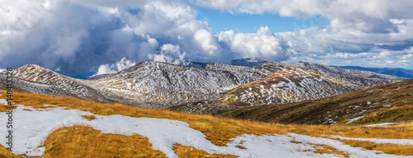 Obraz Beautiful panorama of snow covered Australian Alps and yellow grass. New South Wales, Australia