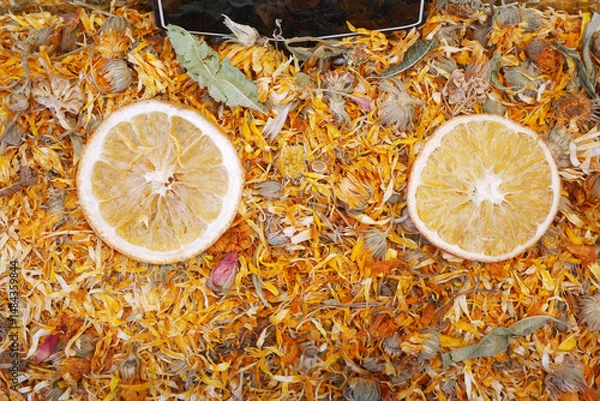 Obraz Dried citrus and herbs displayed at a market stall