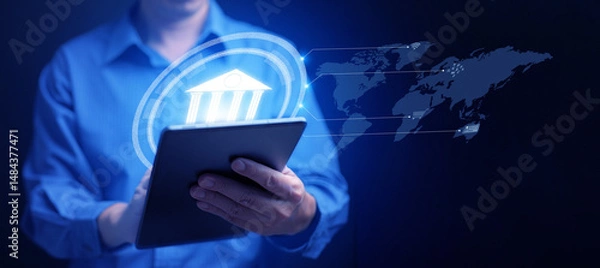 Fototapeta Online digital banking and financial technology concept: A man uses his tablet to access mobile transactions worldwide