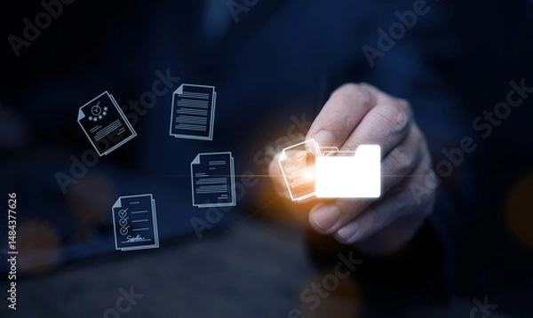 Fototapeta Document Management System concept. A man drags and drops files into DMS software to store, share, track and manage files or documents.