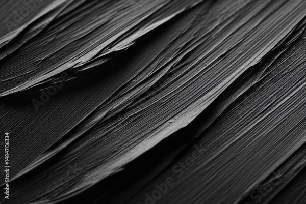 Fototapeta Abstract black paint texture with dynamic brush strokes creating a sense of movement. suitable for backgrounds in artistic or modern design projects
