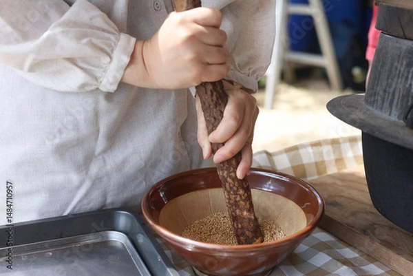 Obraz ごまをする女性