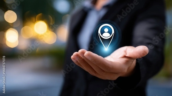 Fototapeta A businessman holding a glowing user location icon in his palm, symbolizing data access.
