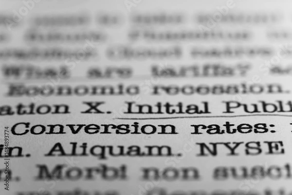 Obraz Conversion rates.. Text printed on a page. A piece of paper with a phrase written in retro typewriter font. Banking