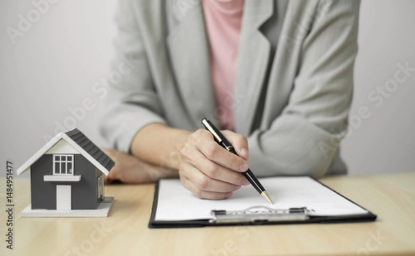 Obraz cagents working in real estate investment and home insurance signing contracts in accordance with the home buying insurance agreements approving purchases for clients