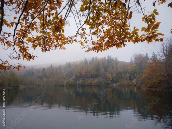 Fototapeta Plitvice Lakes in Croatia during autumn, showcasing stunning waterfalls, vibrant foliage, and crystal-clear waters, creating a magical and serene natural landscape perfect for nature lovers.
