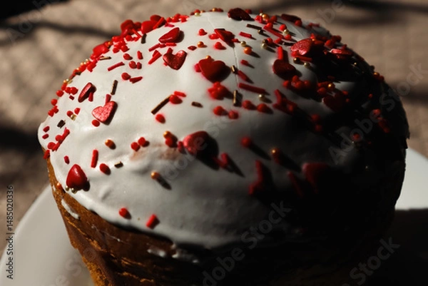 Obraz Easter cake decorated with sugar sprinkles. Delicious Easter cake decorated with red sprinkles