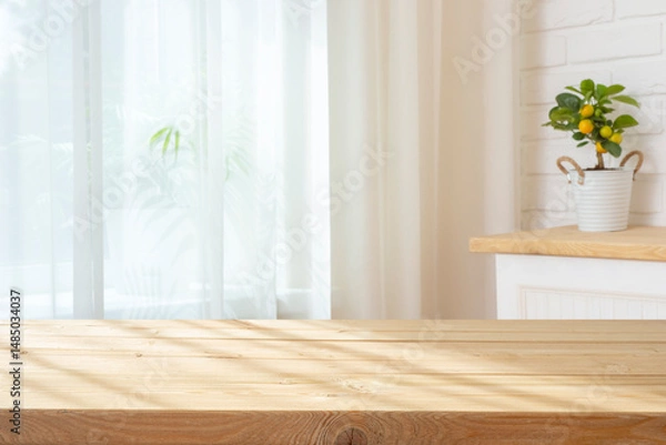 Fototapeta Wooden planks table with sunlight shadows for product display on curtained window interior background