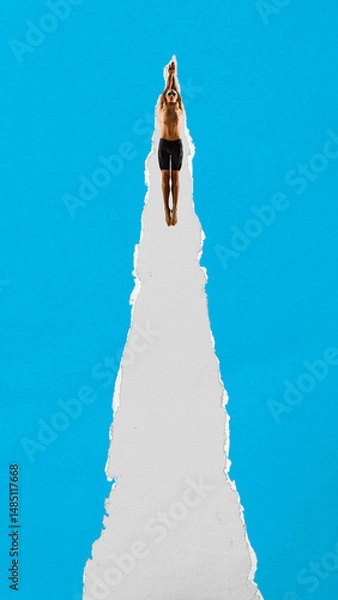 Fototapeta Male swimmer dives with arms forward through torn paper stripe against blue background. Textured scrap design. Contemporary collage. Concept of sport, competition, performance, strength