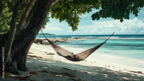 Fototapeta Tropical beach scene featuring a hammock suspended between two trees