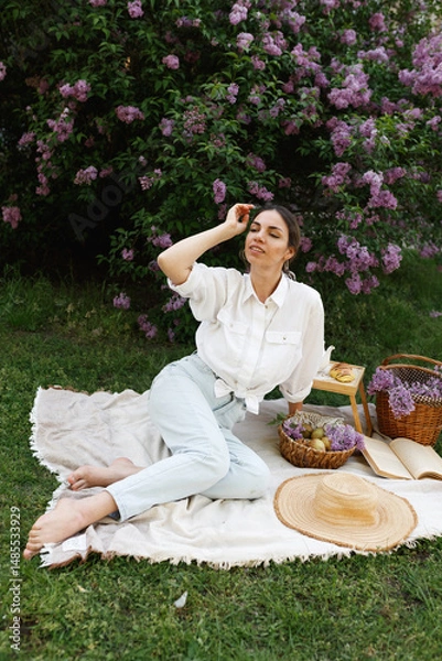 Obraz Woman Embraces Fragrant Lilac Blooms In Spring