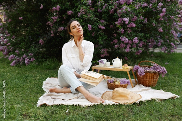 Obraz Woman Embraces Fragrant Lilac Blooms In Spring