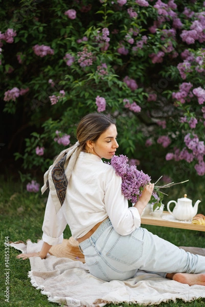 Obraz Woman Embraces Fragrant Lilac Blooms In Spring
