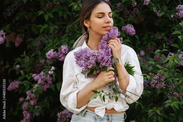 Obraz Woman Embraces Fragrant Lilac Blooms In Spring