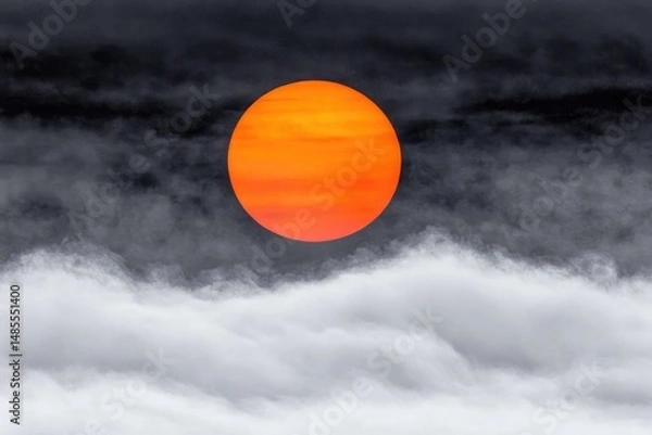 Fototapeta Fiery orb piercing through a dark sky
