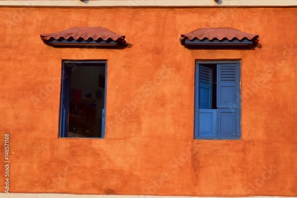 Fototapeta blue windows orange wall