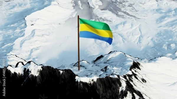 Fototapeta The national flag of Gabon flying proudly atop a snowy mountain peak in ultra-high 4K resolution, symbolizing strength, identity, and patriotism of the African nation.

