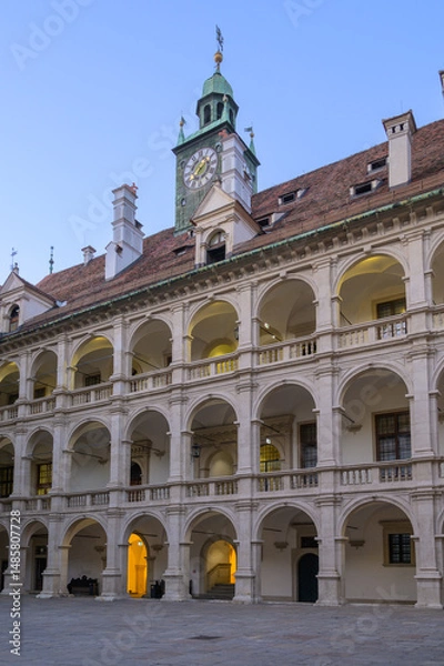 Fototapeta Historic courtyard features beautiful architecture in Graz Austria at twilight