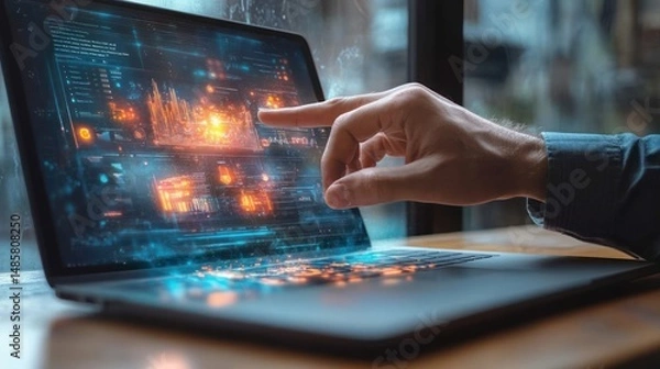 Fototapeta Close-up of a hand interacting with a futuristic holographic data interface projected from a laptop screen in a modern workspace
