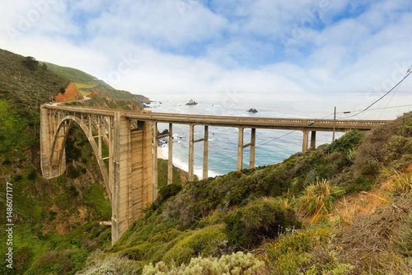 Obraz The Big Sur bridge, also referred to Bixby Bridge on a sunny day, Carmel, California. The bridge is a reinforced concrete open-spandrel arch bridge located on State Route 1 in Big Sur, California.