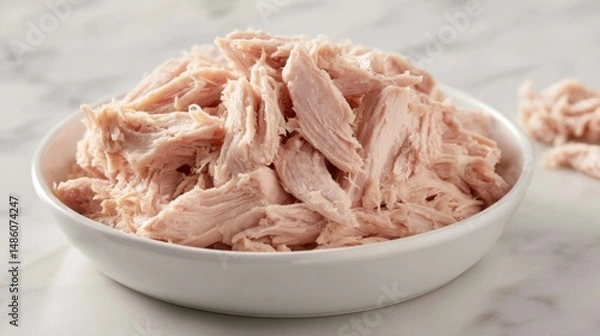 Fototapeta A white plate with a pile of meat on it