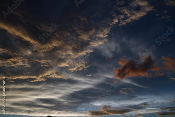 Fototapeta Photo of cloudy sky approaching dusk