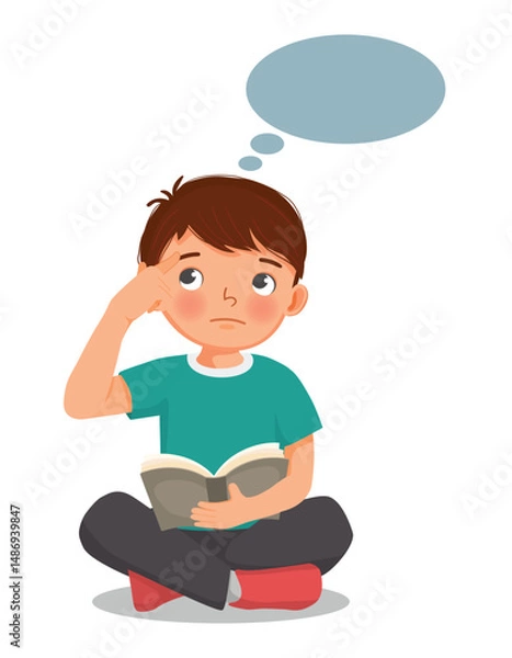 Obraz Little boy reading book thinking day dreaming sitting on floor