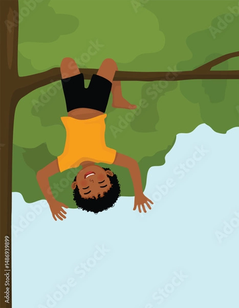 Obraz Little African boy climbing a tree hanging from the tree branch upside down