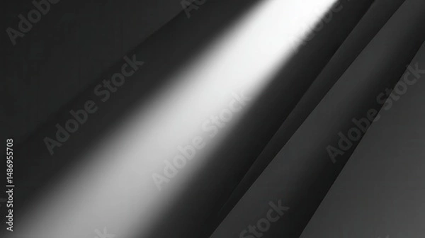 Fototapeta Spotlight illuminating dark, smooth surface.