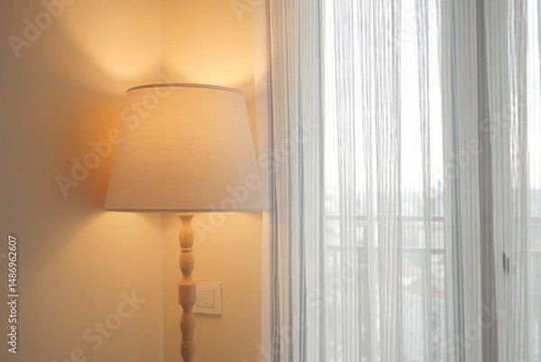 Obraz Warm vibe from lamp by sheer curtains