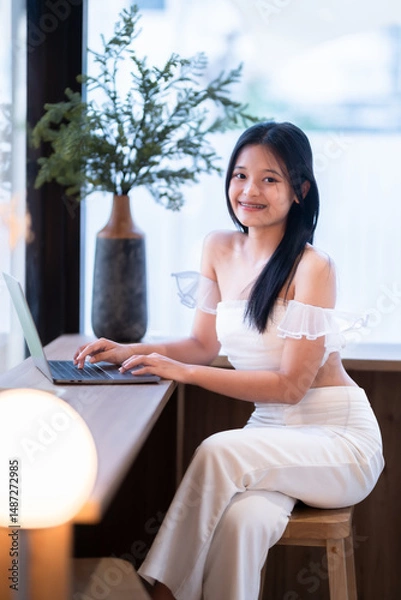 Obraz Portrait of asian freelance teenage people businesswoman casual working with laptop computer in cafe interior in coffee shop background,business expressed confidence embolden and successful concept