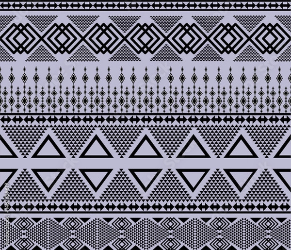 Obraz Geometric ethnic pattern vector design featuring bold symmetrical shapes and traditional tribal motifs. Inspired by indigenous art from various cultures, this seamless design combines modern aesthetic