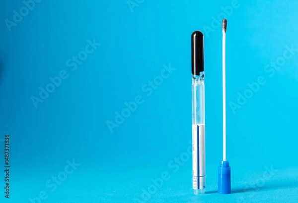Fototapeta Smear for flora and bacterial culture in men and women on a blue background in urology and gynecology. Sexually transmitted infections. Copy space for text