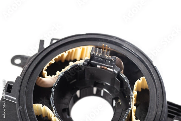 Fototapeta disassembled broken steering column electrical cable on white background, isolate, close-up